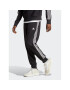 adidas Spodnji del trenirke AEROREADY Essentials Tapered Cuff Woven 3-Stripes Joggers IC0041 Črna Regular Fit - Pepit.si