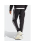 adidas Spodnji del trenirke AEROREADY Essentials Tapered Cuff Woven 3-Stripes Joggers IC0041 Črna Regular Fit - Pepit.si