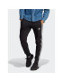 adidas Spodnji del trenirke Essentials French Terry Tapered Cuff 3-Stripes Joggers HA4337 Črna Regular Fit - Pepit.si