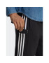 adidas Spodnji del trenirke Essentials French Terry Tapered Cuff 3-Stripes Joggers HA4337 Črna Regular Fit - Pepit.si