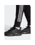 adidas Spodnji del trenirke Essentials French Terry Tapered Cuff 3-Stripes Joggers HA4337 Črna Regular Fit - Pepit.si