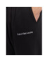 Calvin Klein Jeans Spodnji del trenirke J30J322925 Črna Relaxed Fit - Pepit.si