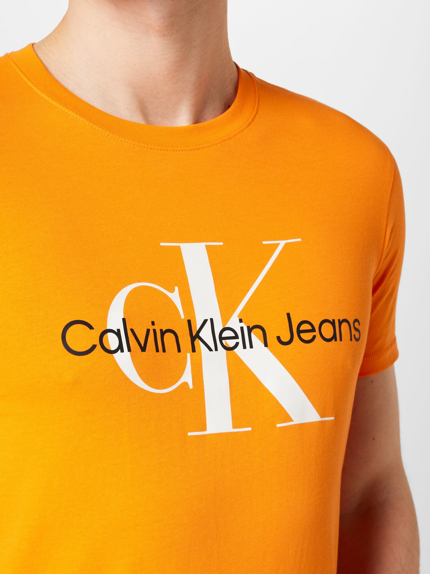 Calvin Klein Jeans Majica oranžna / črna / bela - Pepit.si