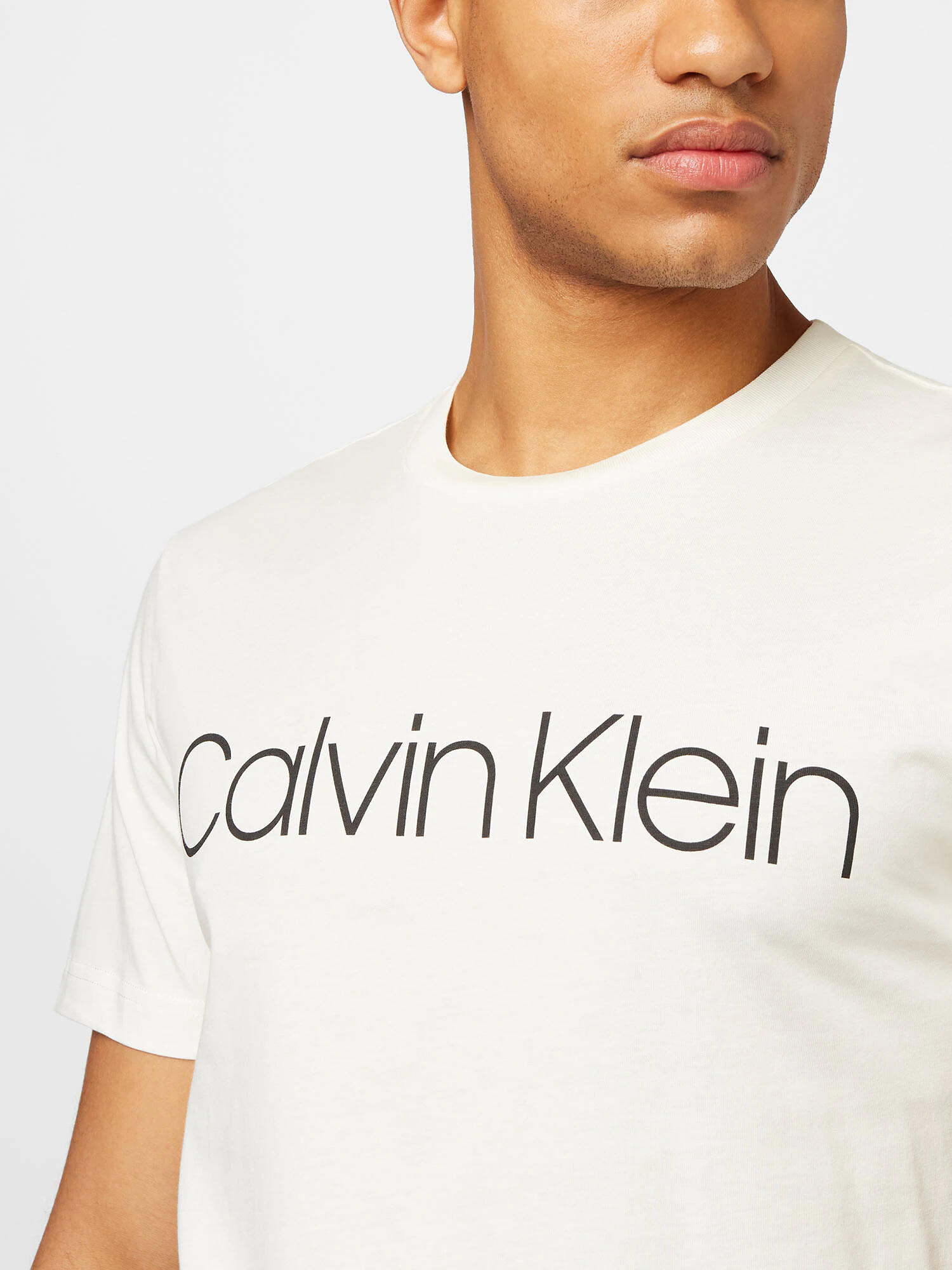 Calvin Klein Majica kremna / črna - Pepit.si