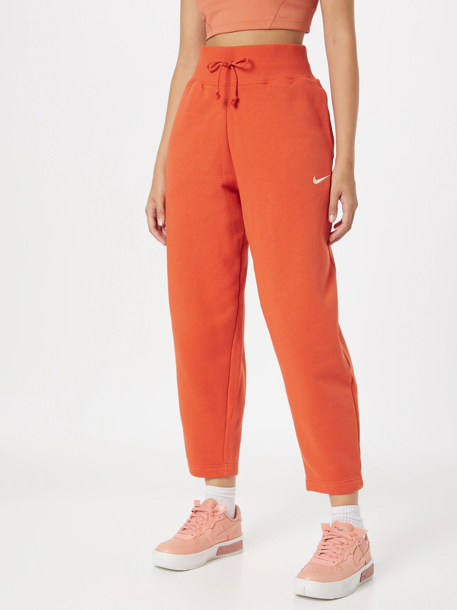 Nike Sportswear Hlače oranžno rdeča / bela - Pepit.si