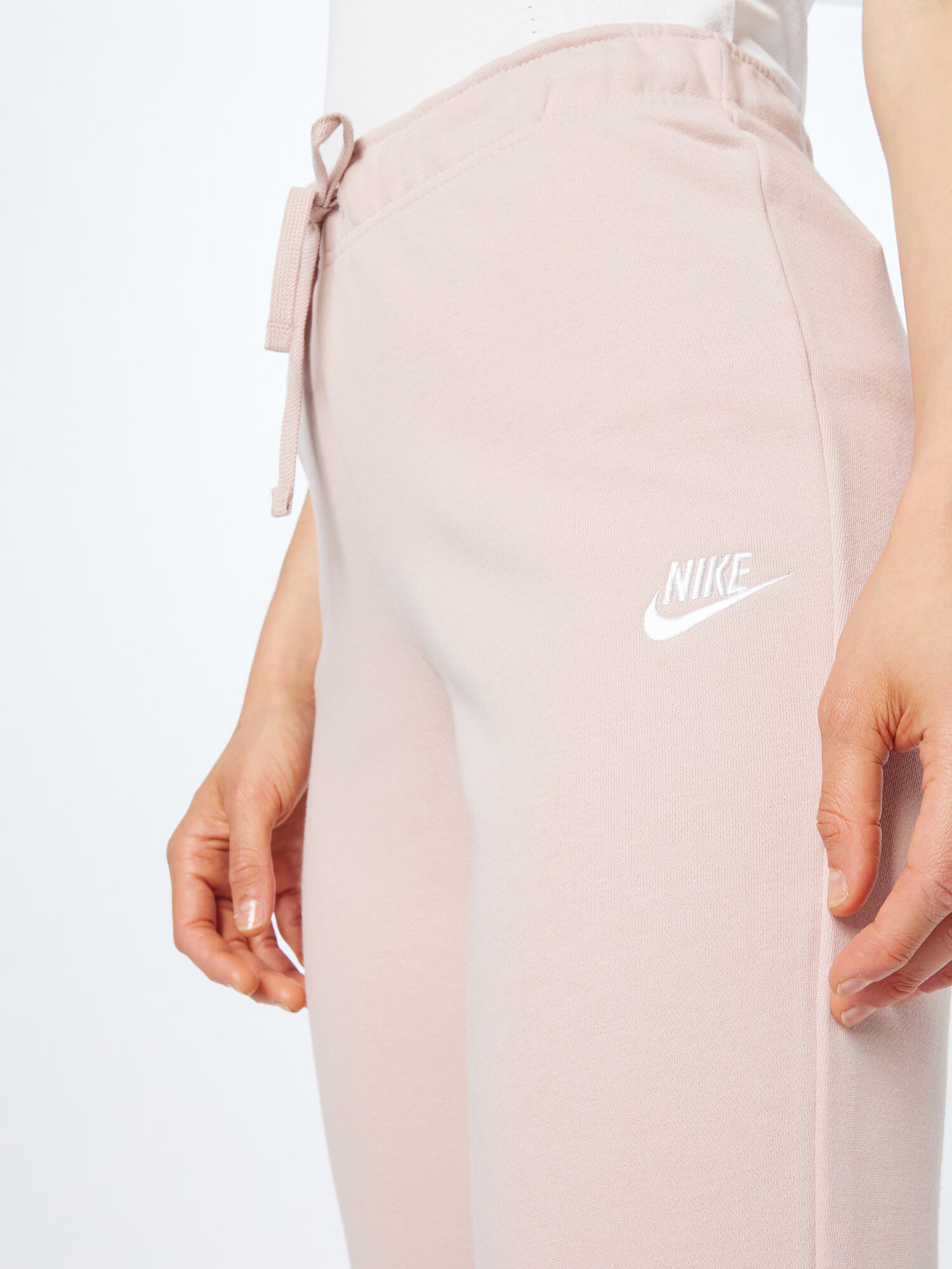 Nike Sportswear Hlače puder / bela - Pepit.si