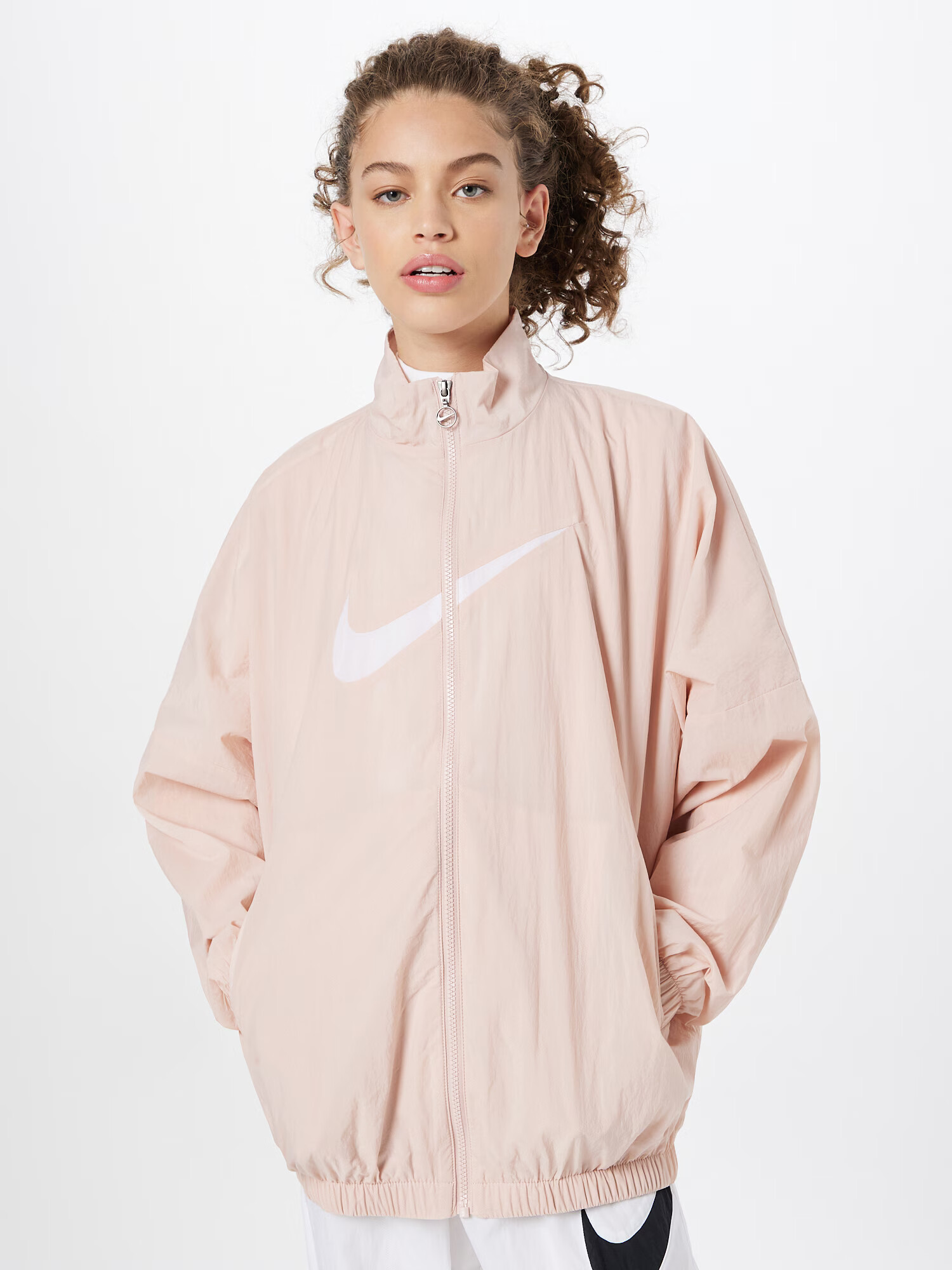 Nike Sportswear Prehodna jakna pastelno roza / bela - Pepit.si