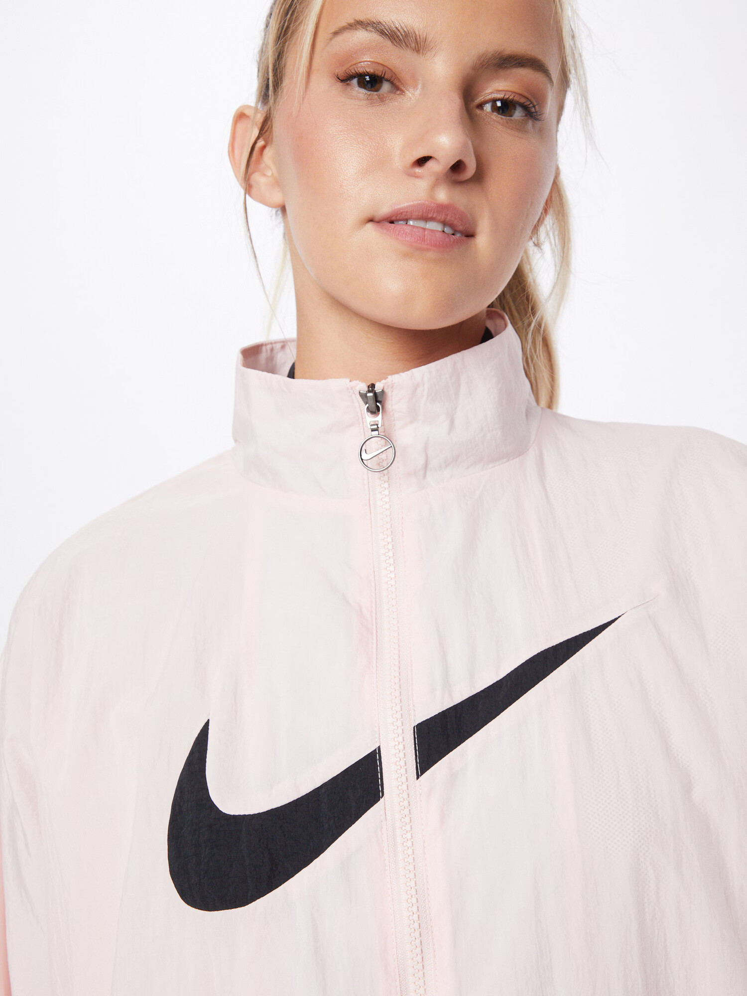 Nike Sportswear Prehodna jakna pastelno roza / črna - Pepit.si