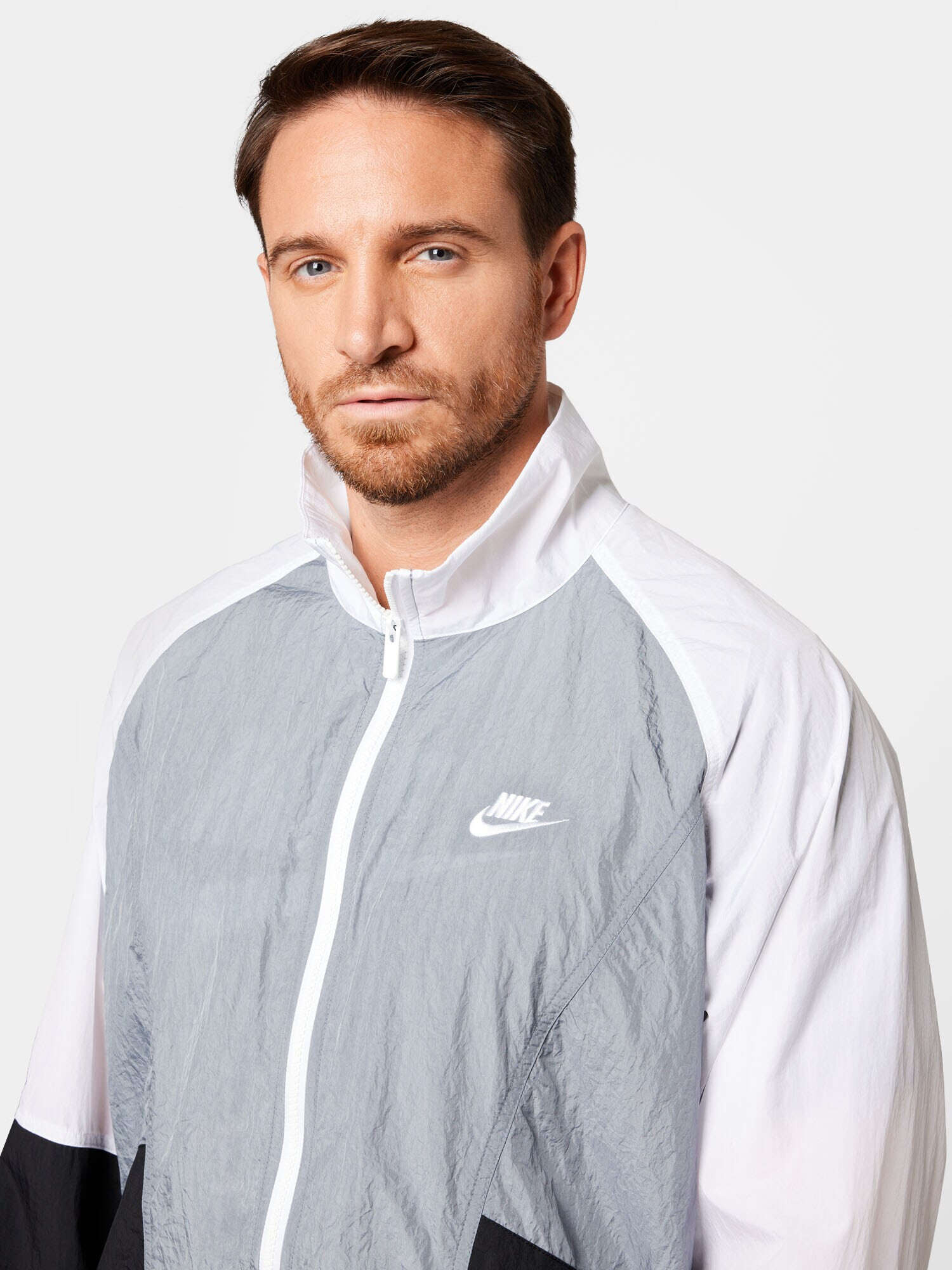 Nike Sportswear Prehodna jakna siva / črna / bela - Pepit.si