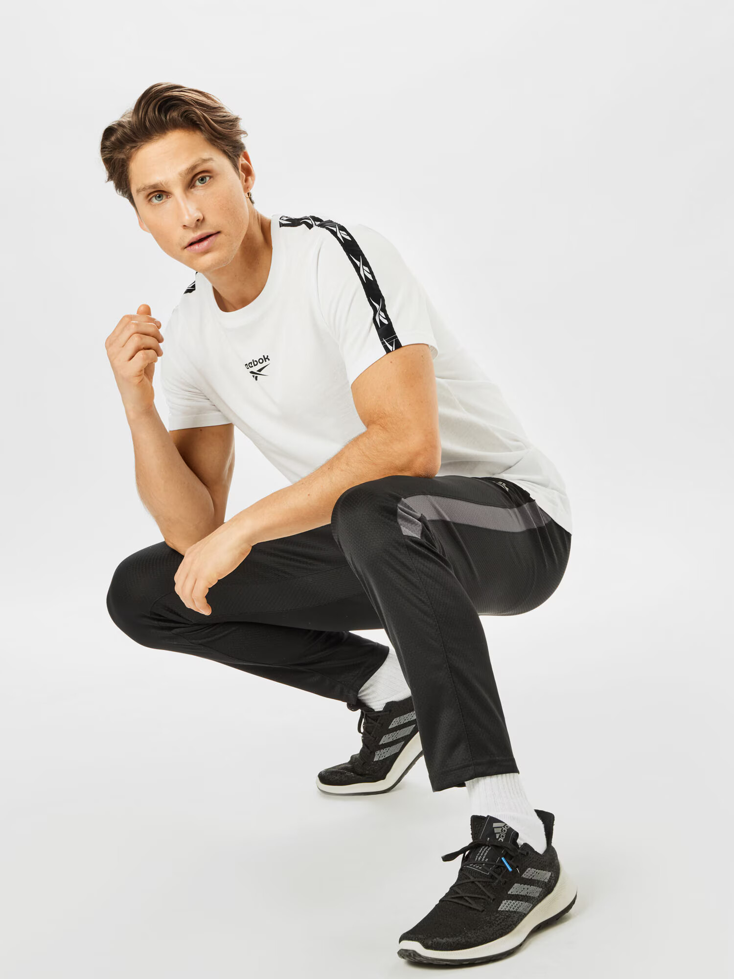 Reebok Sport Funkcionalna majica črna / bela - Pepit.si