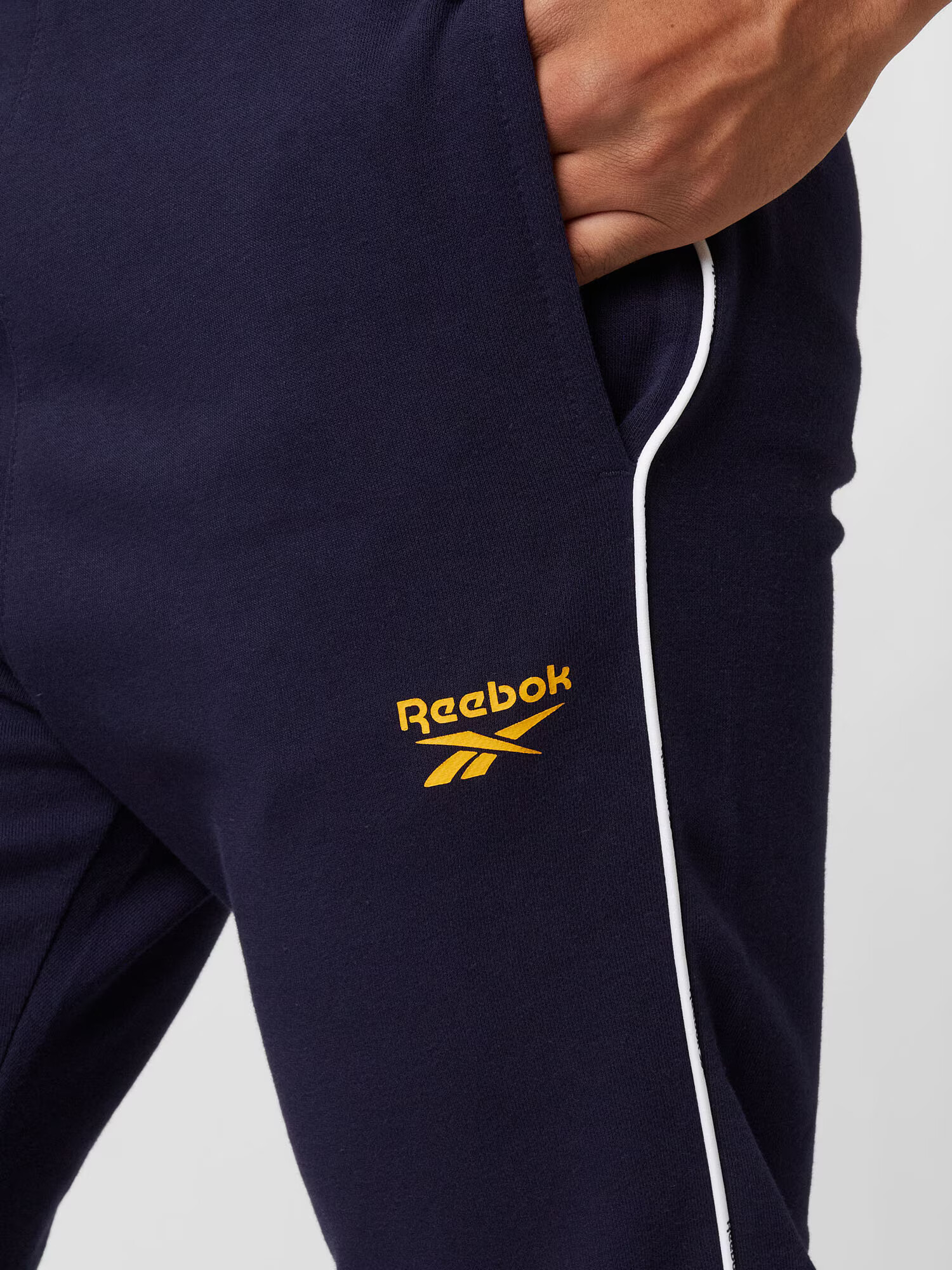 Reebok Sport Športne hlače mornarska / temno rumena / bela - Pepit.si