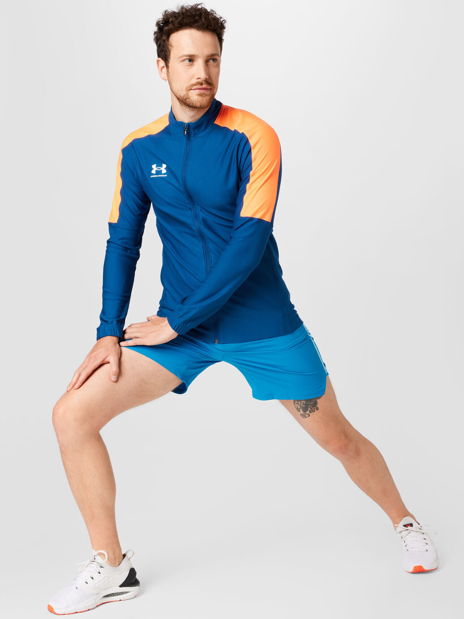 UNDER ARMOUR Športna jakna 'Challenger' modra / oranžna - Pepit.si