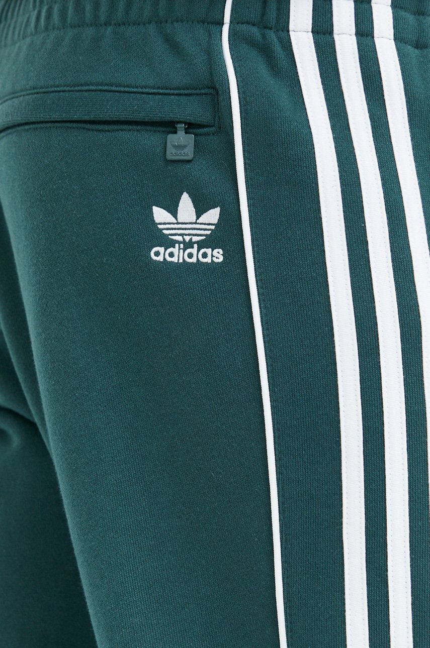 adidas Originals Bombažen spodnji del trenirke moški zelena barva - Pepit.si