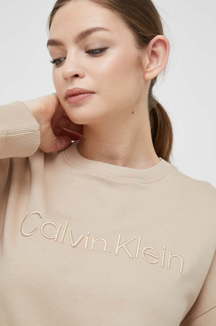 Calvin Klein Bombažen pulover ženska bež barva - Pepit.si