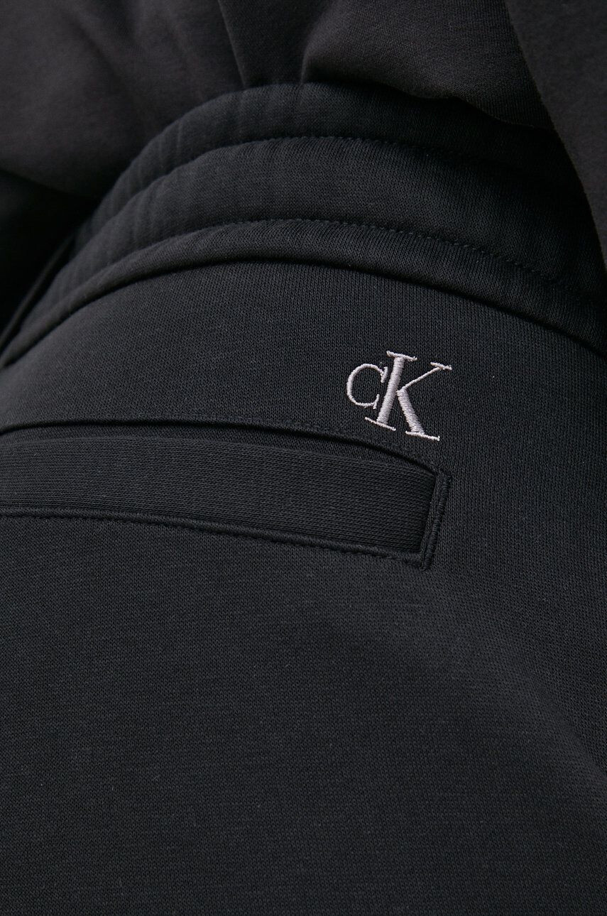 Calvin Klein Jeans Spodnji del trenirke moški črna barva - Pepit.si