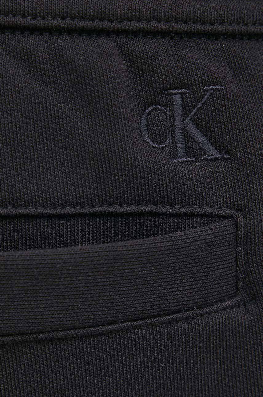 Calvin Klein Jeans Spodnji del trenirke moški črna barva - Pepit.si