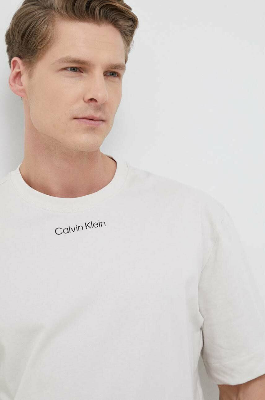 Calvin Klein Performance Kratka majica za vadbo CK Athletic bež barva - Pepit.si