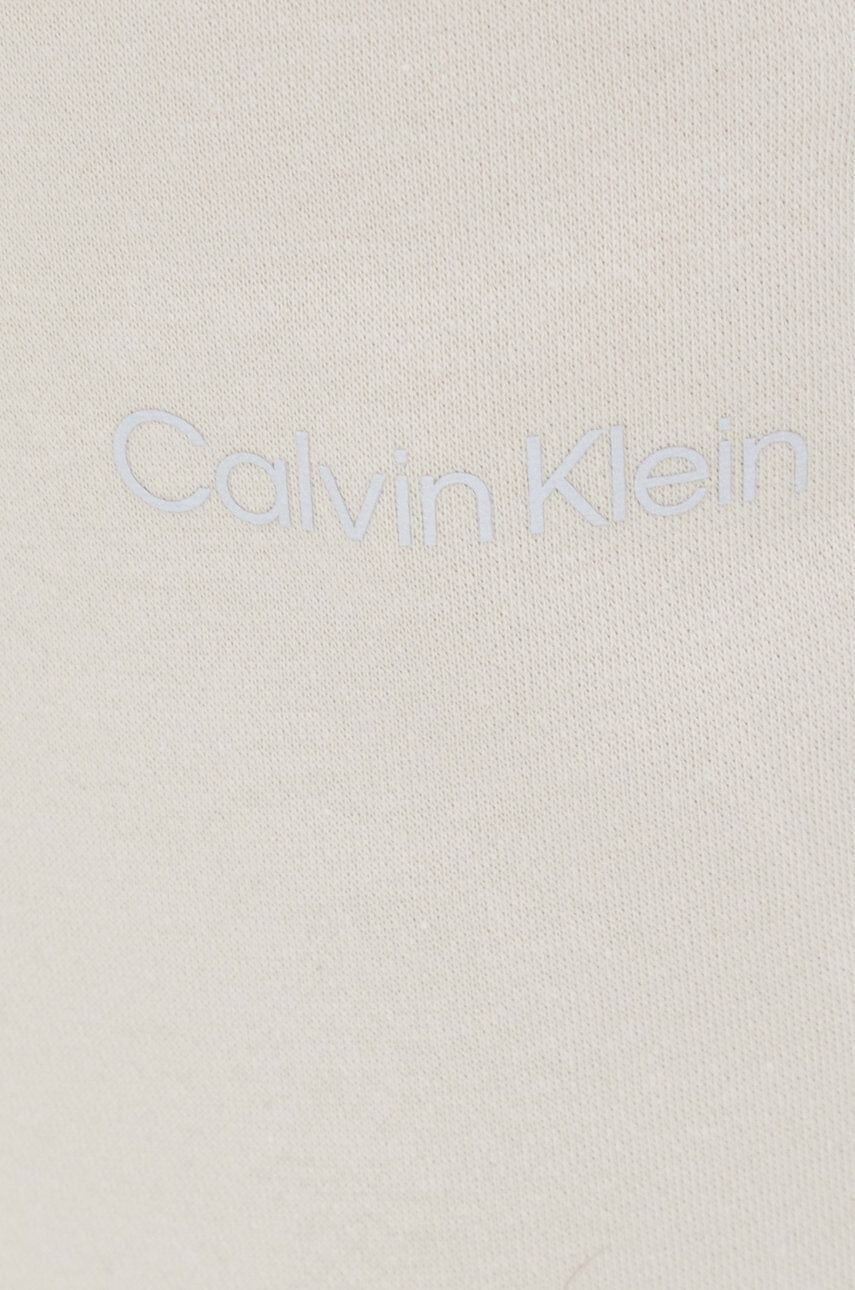 Calvin Klein Performance Spodnji del trenirke ženski bež barva - Pepit.si