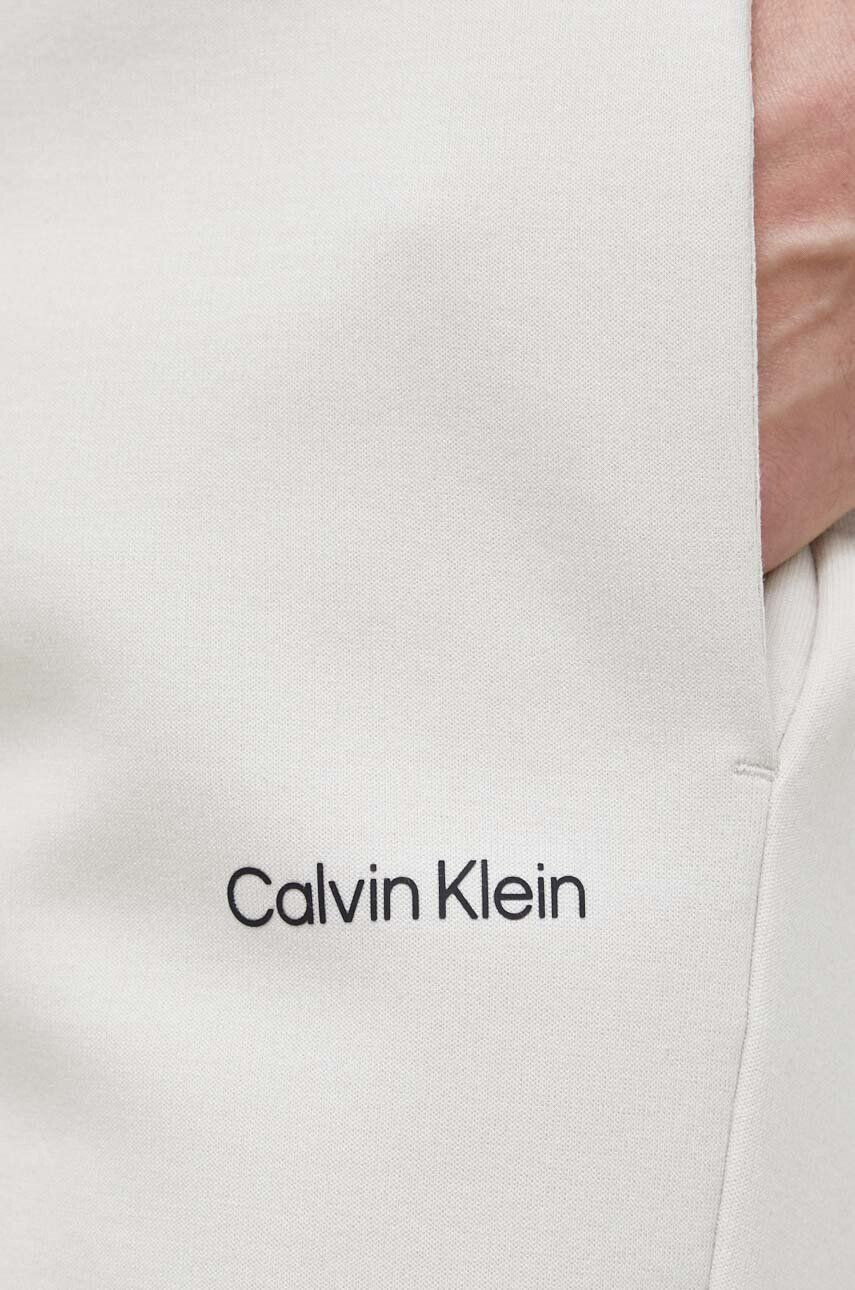 Calvin Klein Spodnji del trenirke moški bež barva - Pepit.si