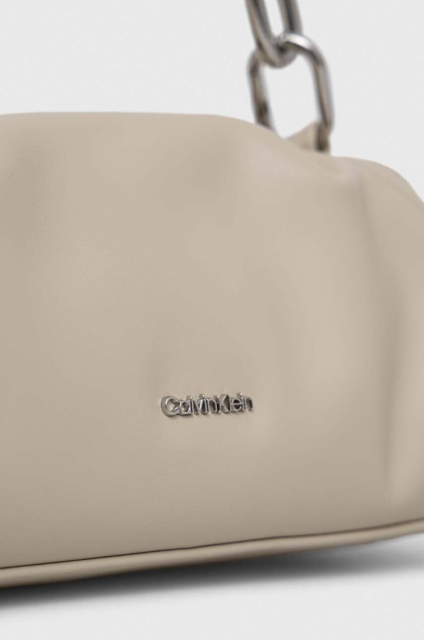 Calvin Klein Torbica bež barva - Pepit.si