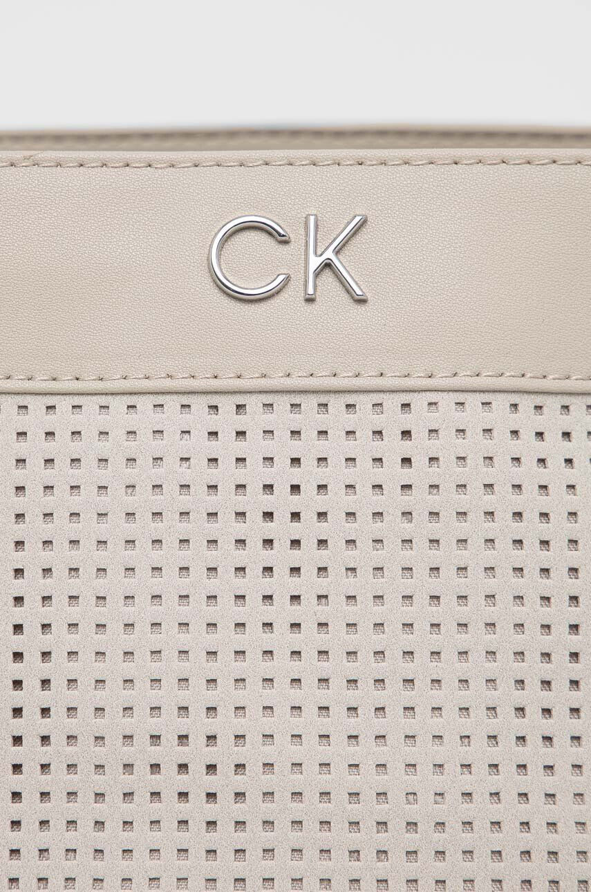 Calvin Klein Torbica bež barva - Pepit.si