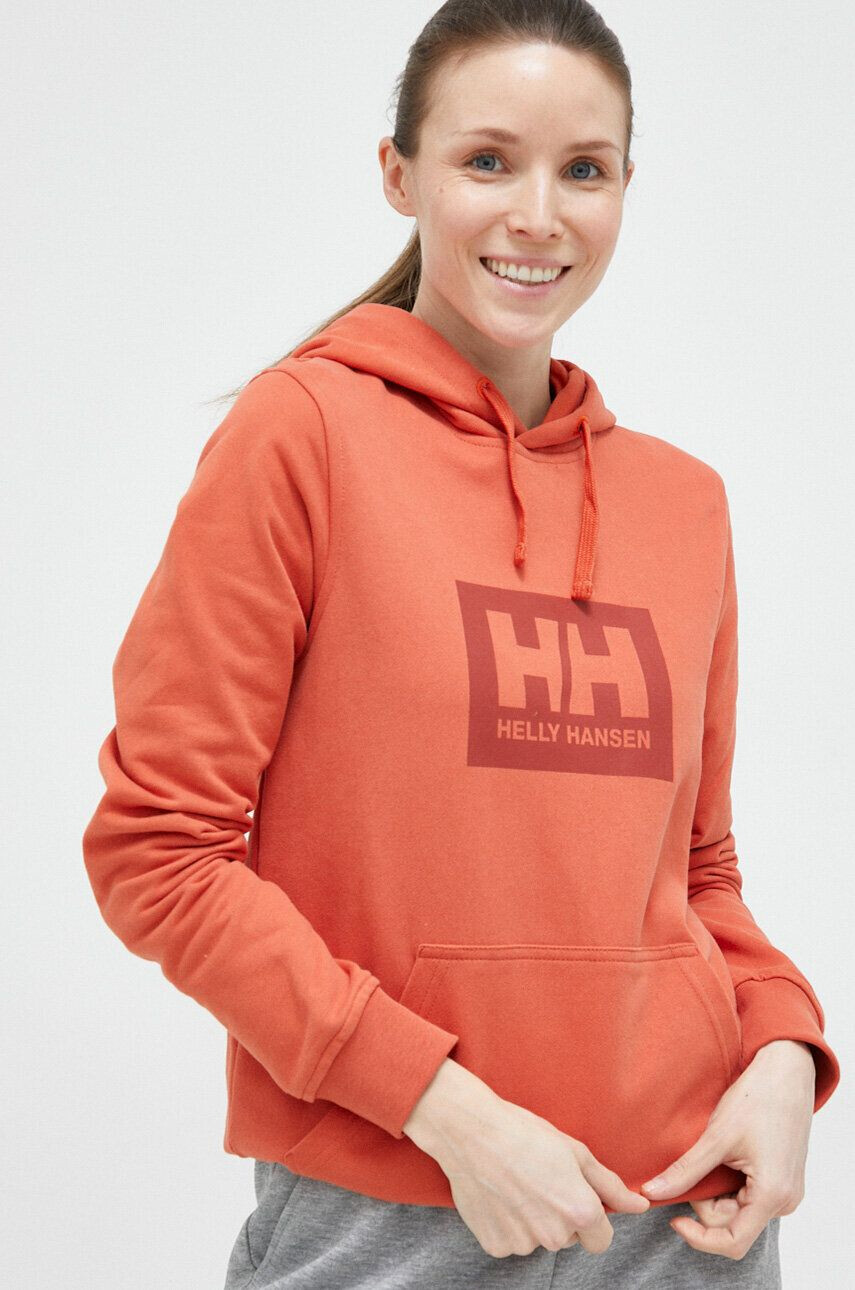 Helly Hansen Bombažen pulover oranžna barva s kapuco - Pepit.si