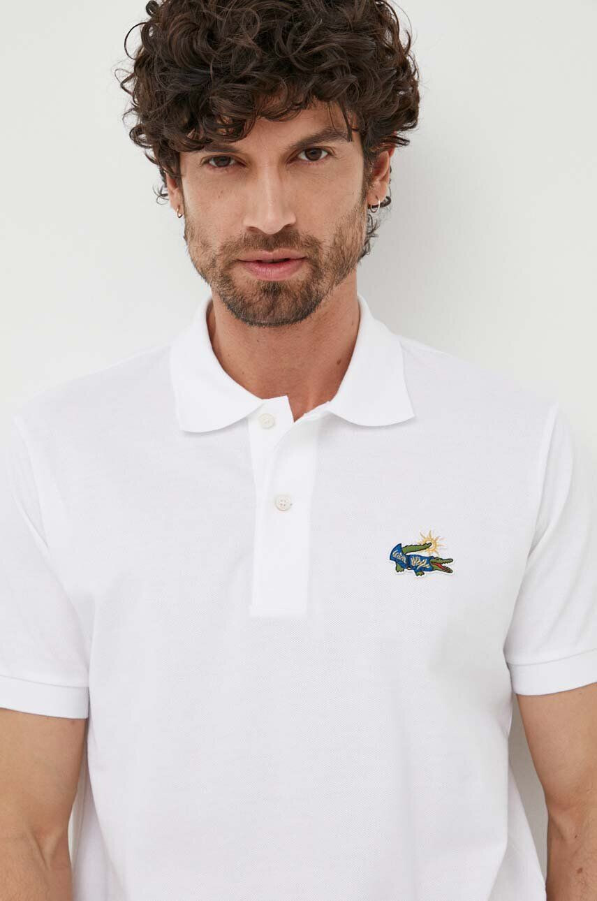 Lacoste Bombažen polo x Netflix bež barva - Pepit.si