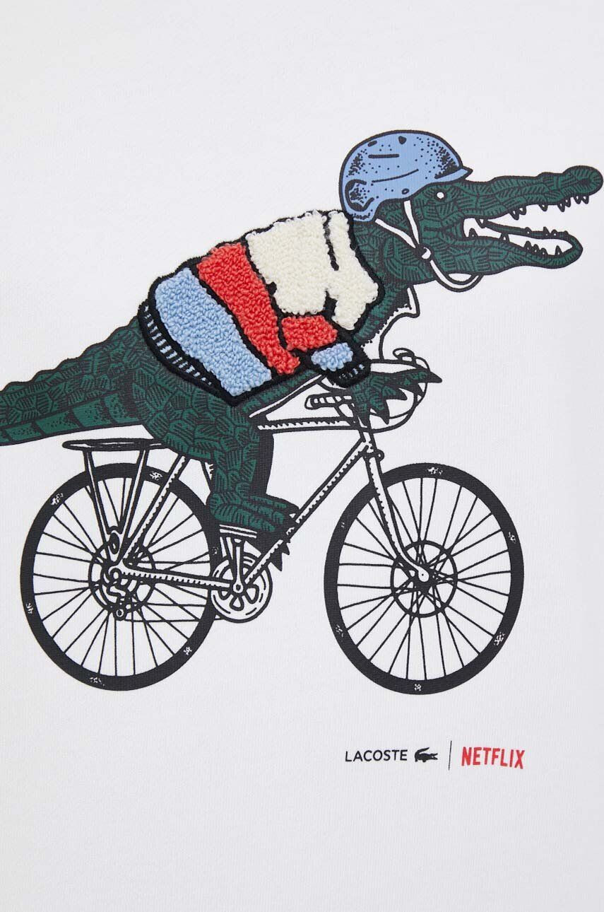 Lacoste Bombažen pulover x Netflix ženski bela barva - Pepit.si