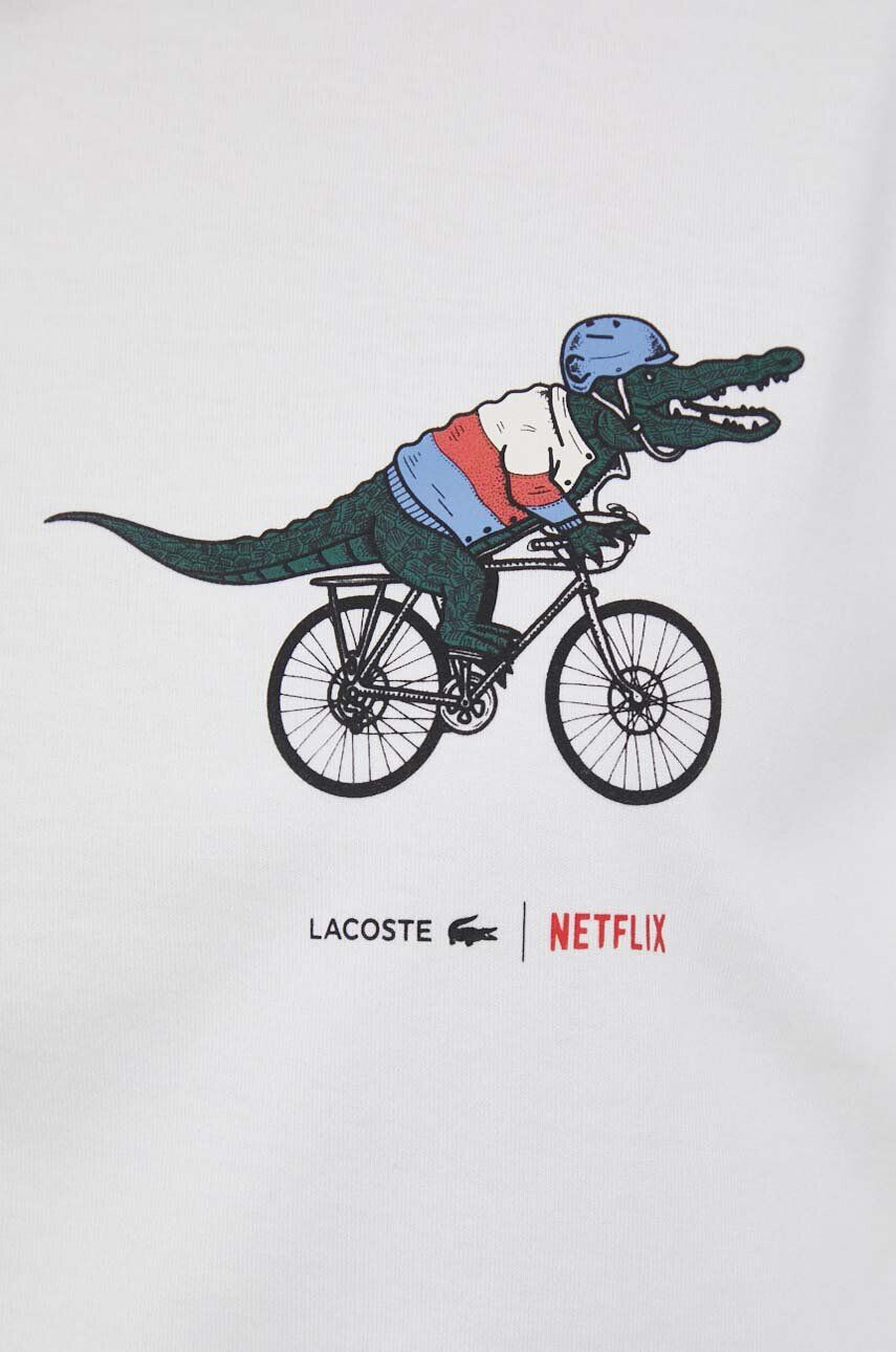 Lacoste Bombažna kratka majica x Netflix bela barva - Pepit.si