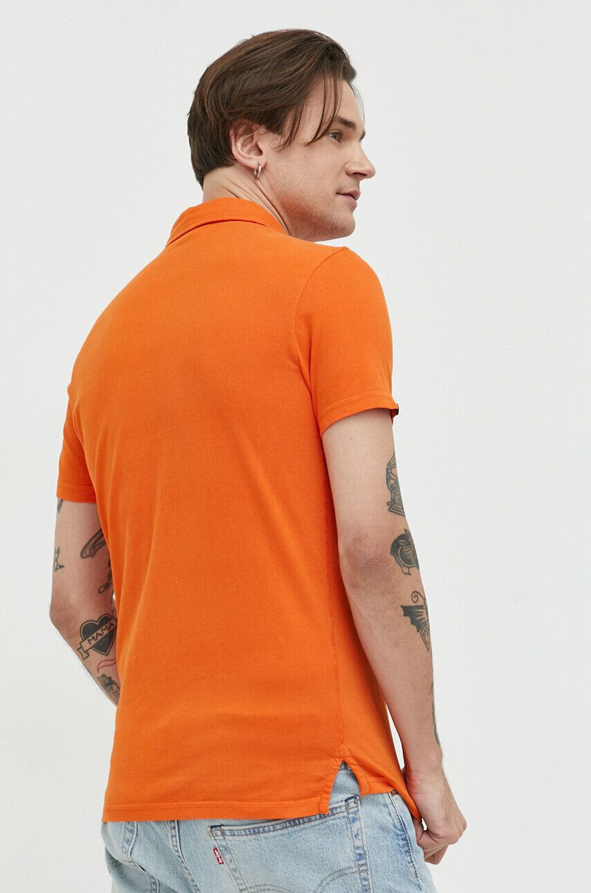 Superdry Bombažen polo oranžna barva - Pepit.si