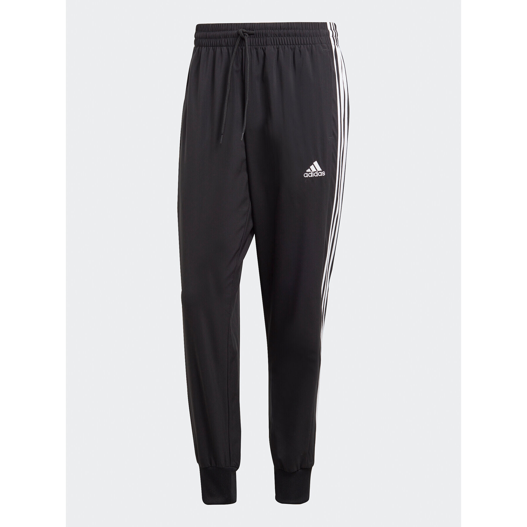 adidas Spodnji del trenirke AEROREADY Essentials Tapered Cuff Woven 3-Stripes Joggers IC0041 Črna Regular Fit - Pepit.si