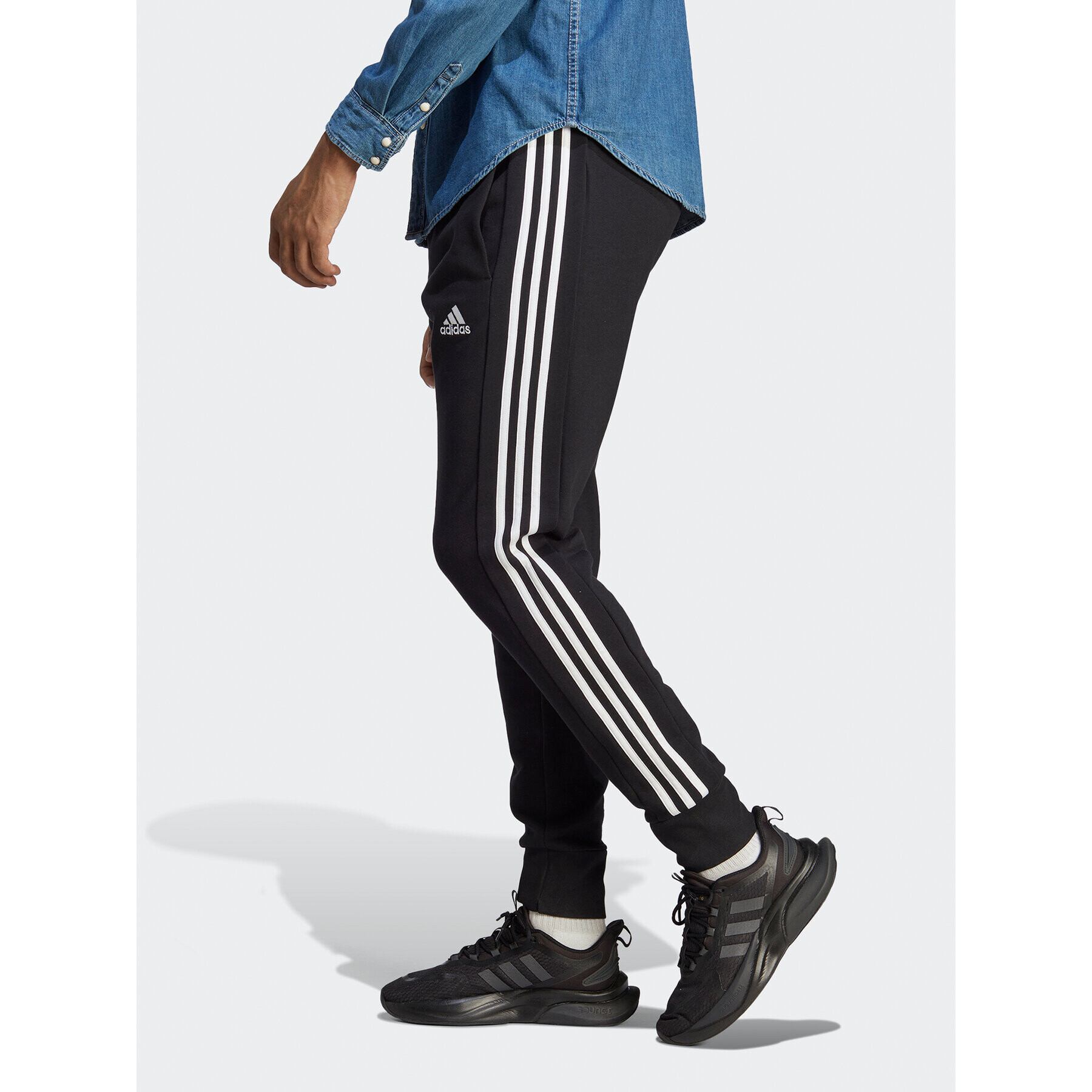 adidas Spodnji del trenirke Essentials French Terry Tapered Cuff 3-Stripes Joggers HA4337 Črna Regular Fit - Pepit.si