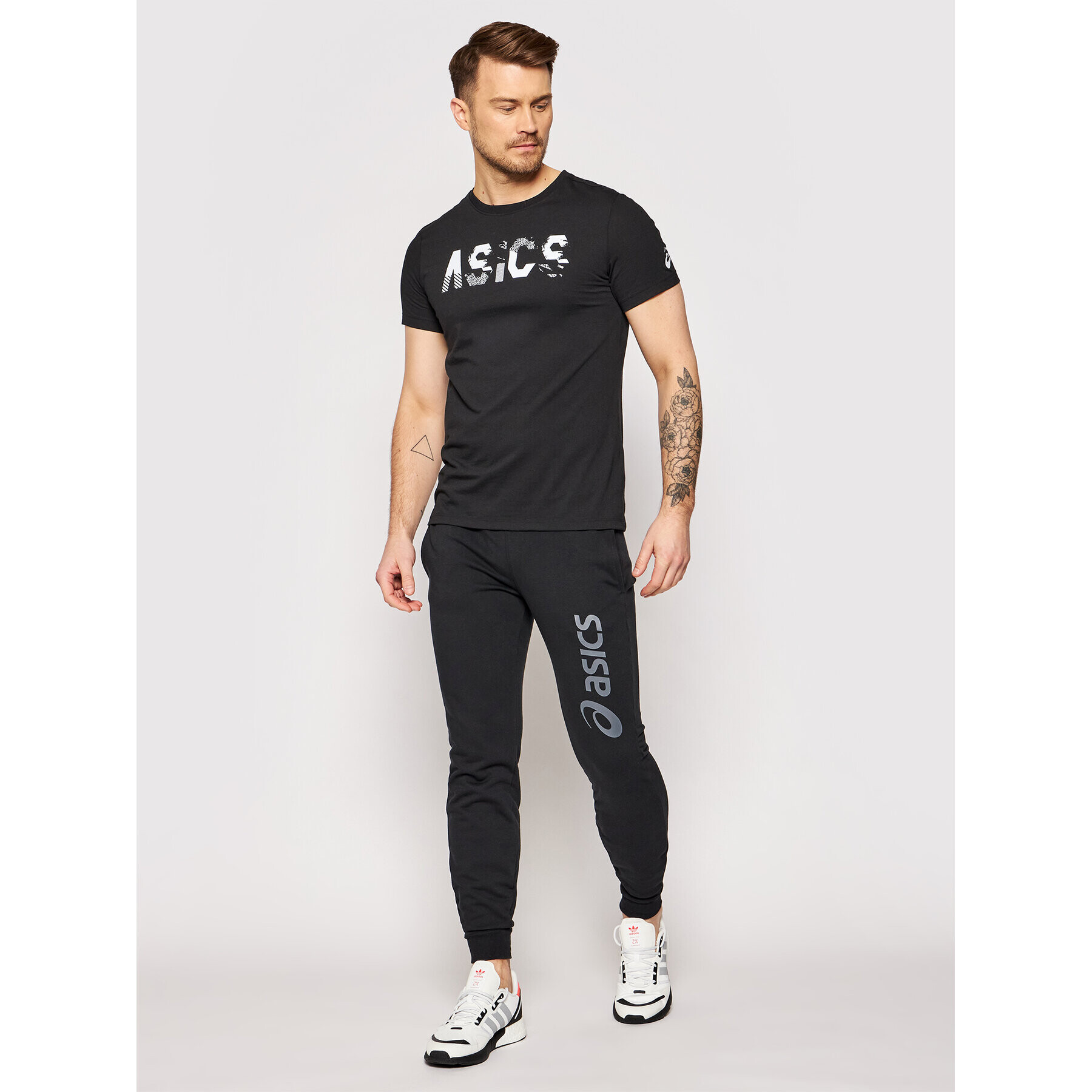 Asics Spodnji del trenirke Big Logo 2031A977 Črna Slim Fit - Pepit.si