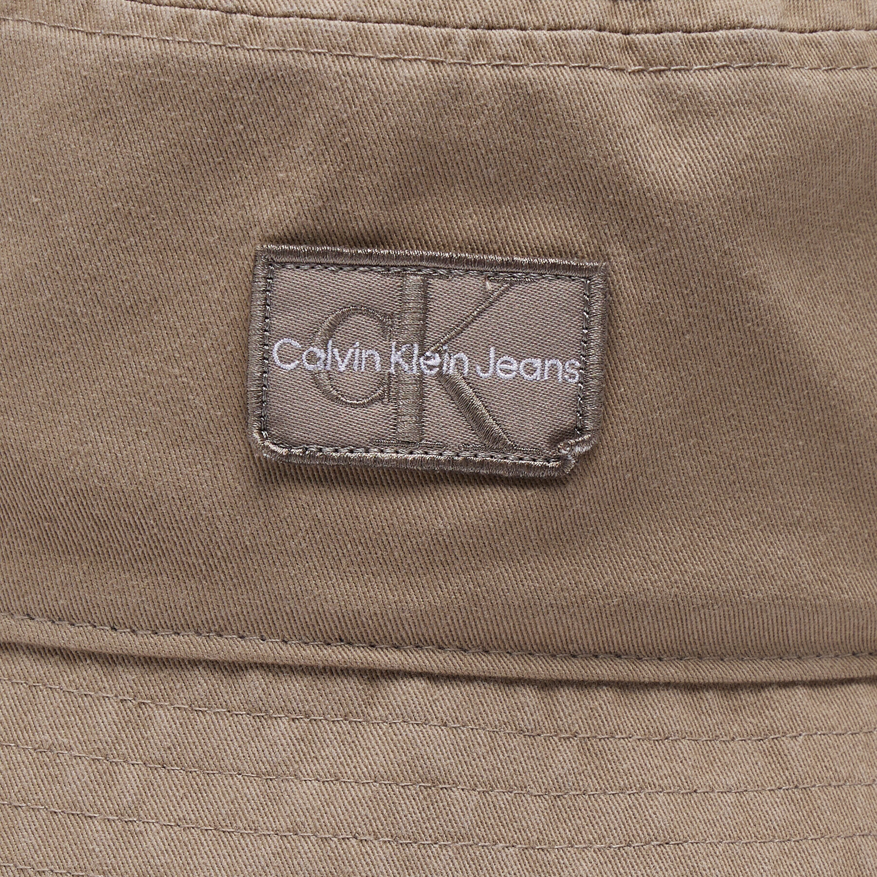 Calvin Klein Jeans Klobuk Bucket Mono Neutral K50K509901A03 Bež - Pepit.si