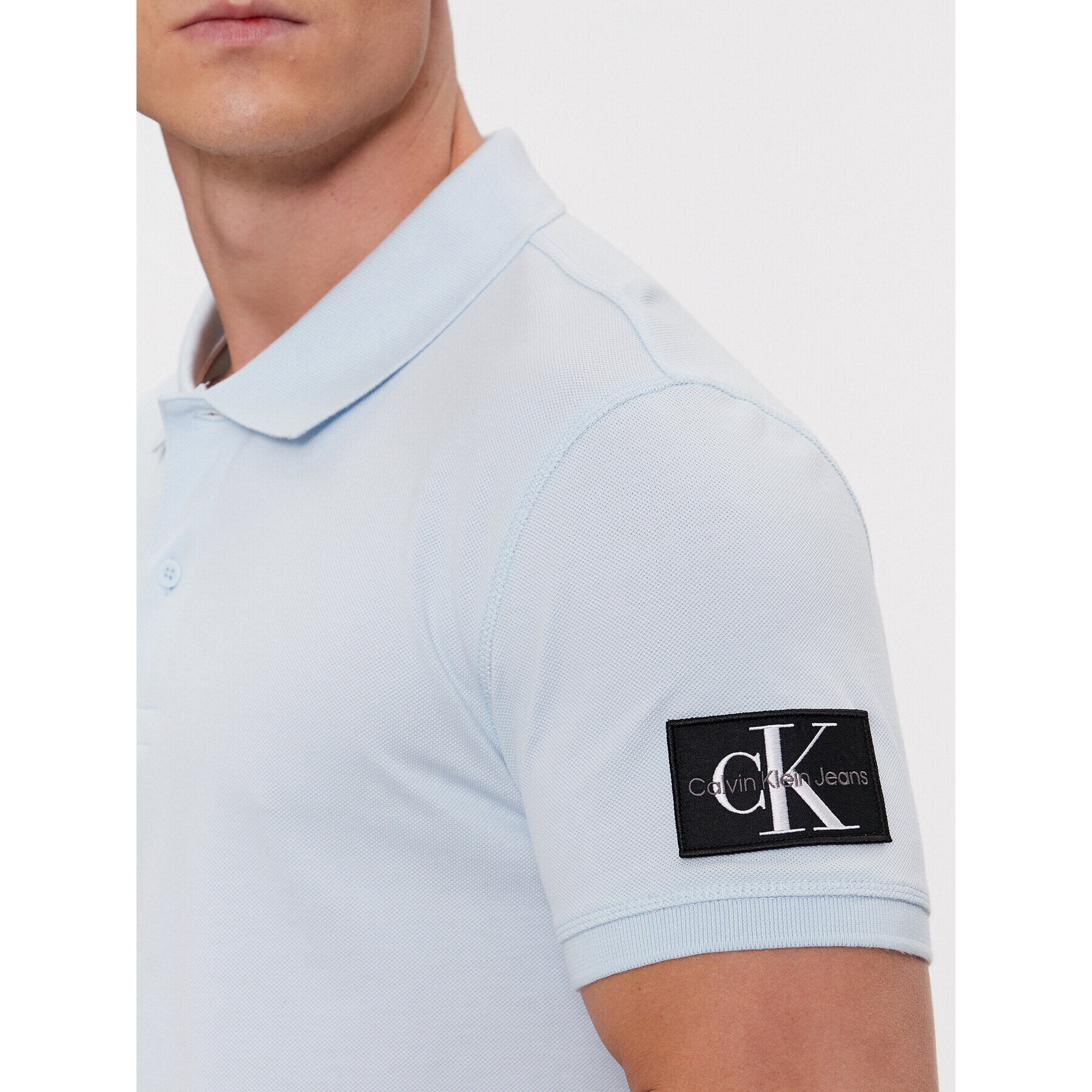 Calvin Klein Jeans Polo majica J30J323394 Modra Regular Fit - Pepit.si