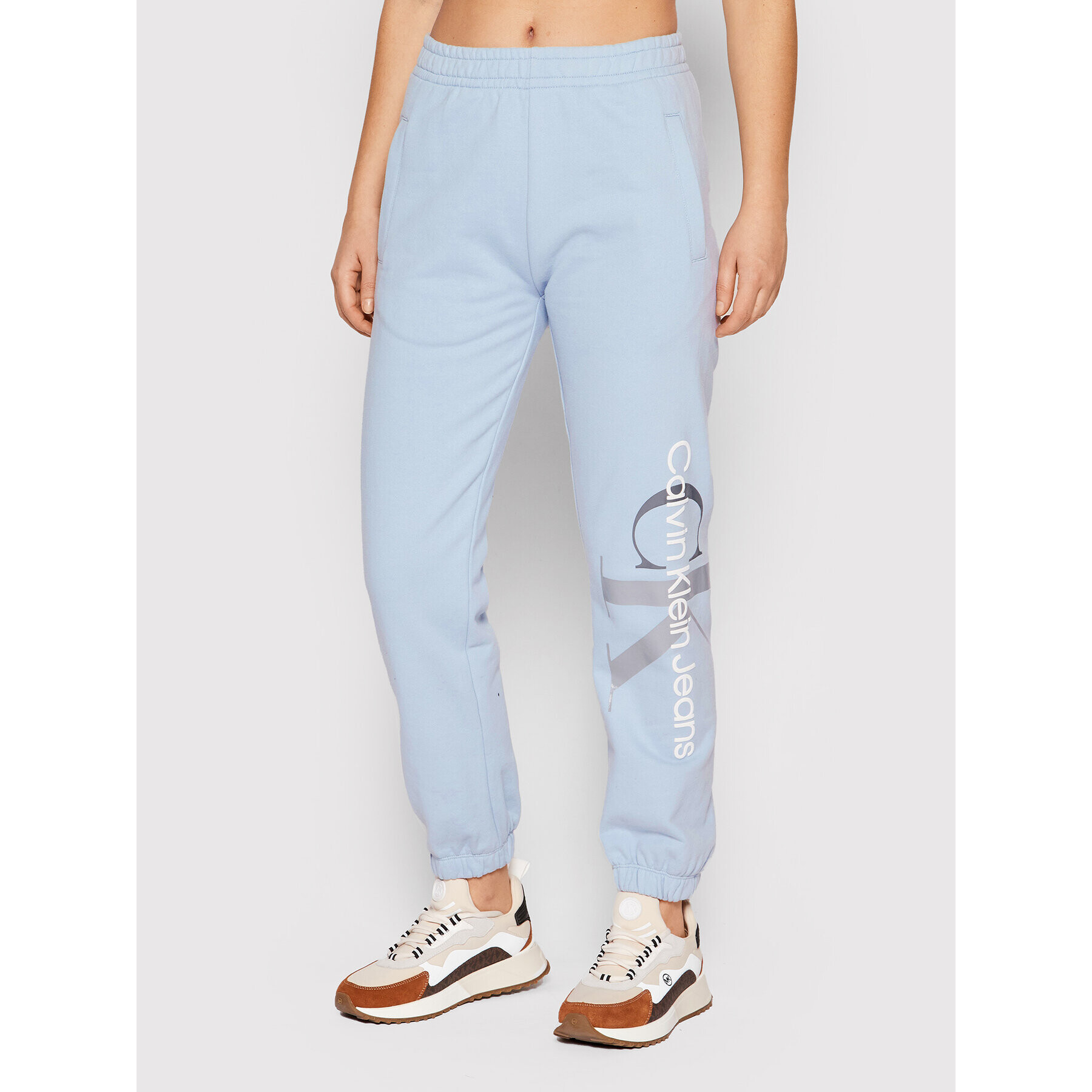 Calvin Klein Jeans Spodnji del trenirke J20J217786 Modra Regular Fit - Pepit.si