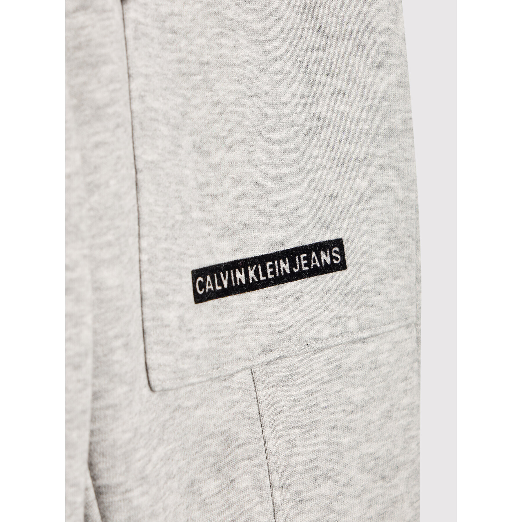 Calvin Klein Jeans Spodnji del trenirke Micro Logo IB0IB01012 Siva Regular Fit - Pepit.si