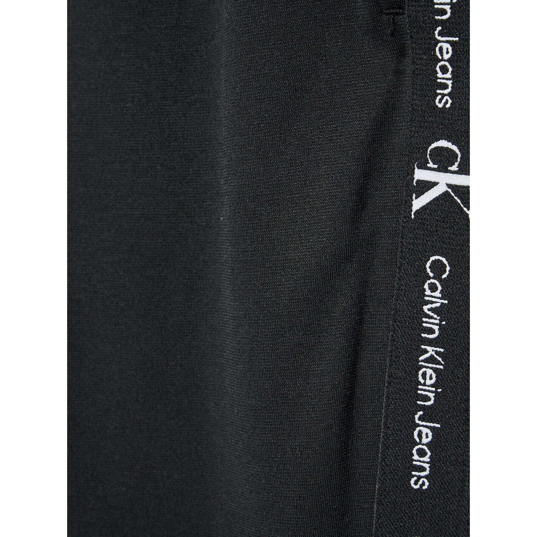 Calvin Klein Jeans Spodnji del trenirke Punto Logo IB0IB01187 Črna Regular Fit - Pepit.si