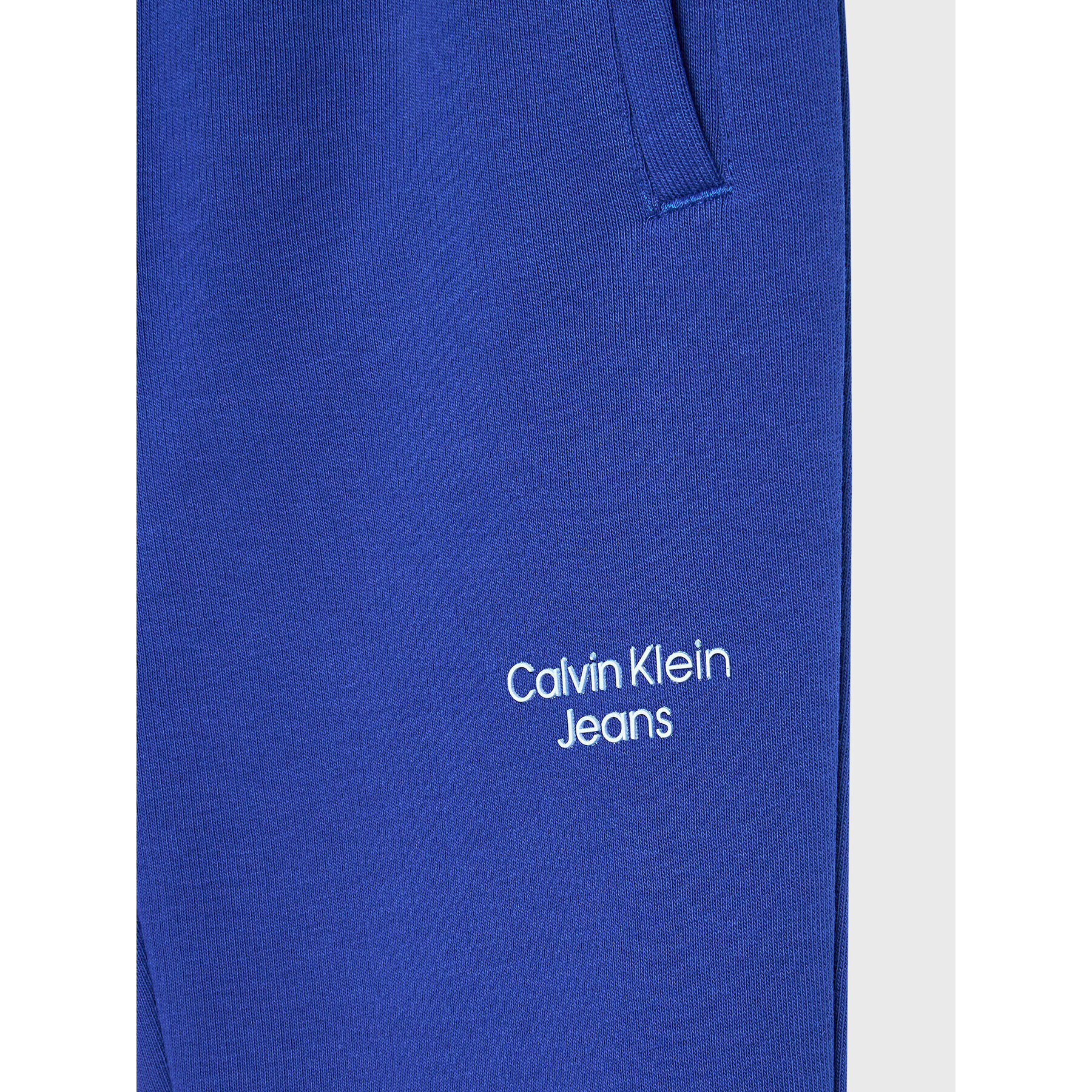 Calvin Klein Jeans Spodnji del trenirke Stack Logo IB0IB01282 Mornarsko modra Regular Fit - Pepit.si