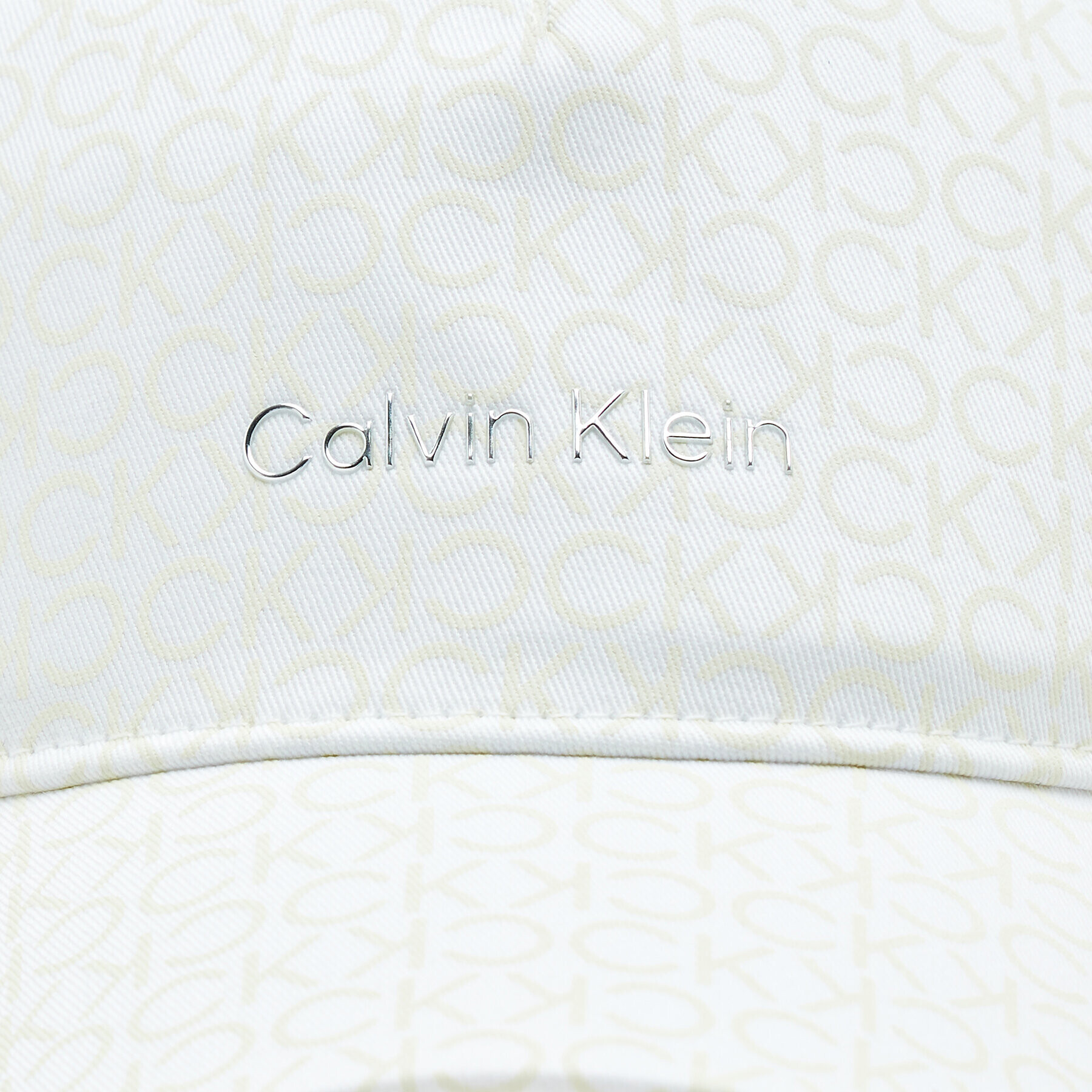 Calvin Klein Kapa s šiltom K60K610990 Écru - Pepit.si