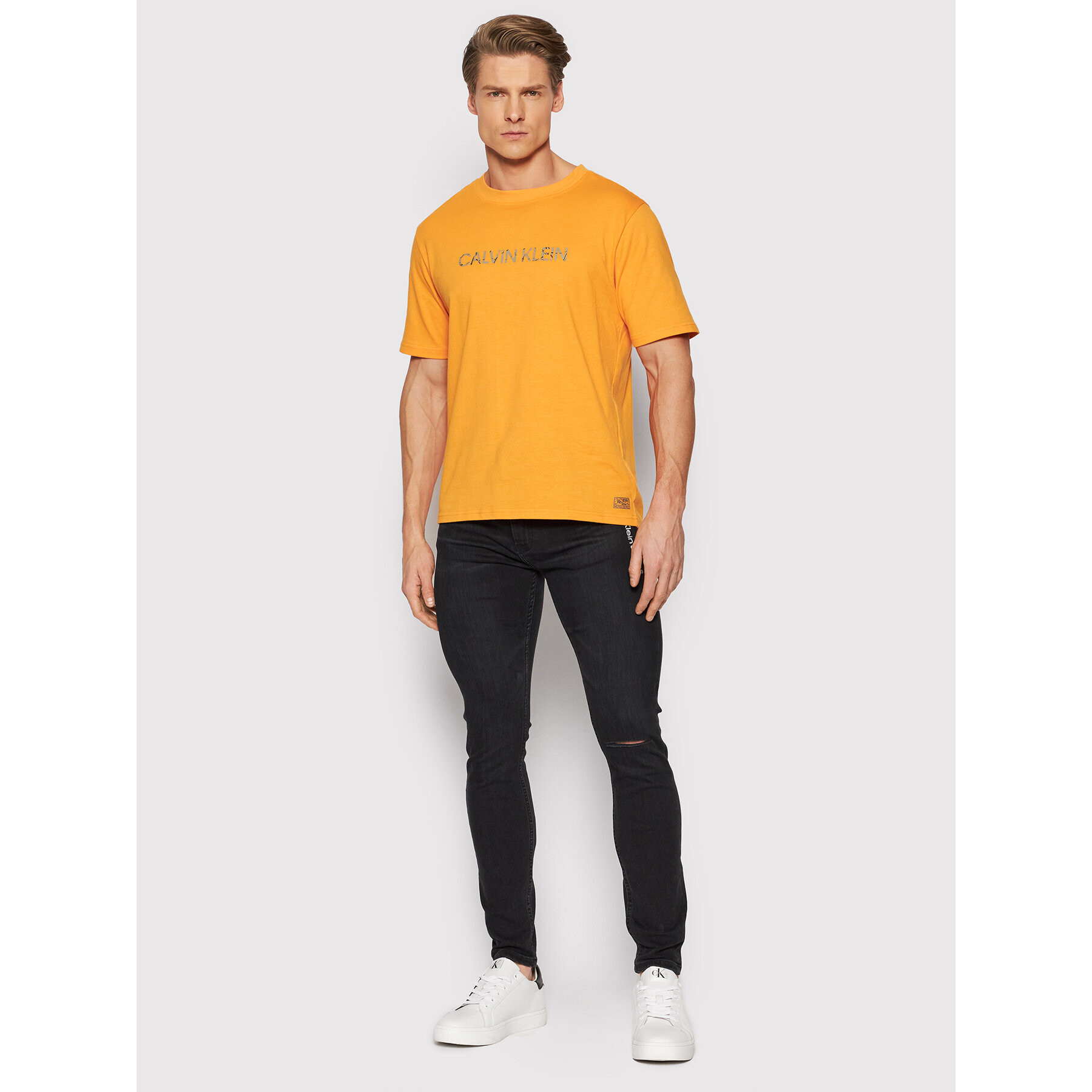 Calvin Klein Performance Majica 00GMH1K104 Oranžna Regular Fit - Pepit.si