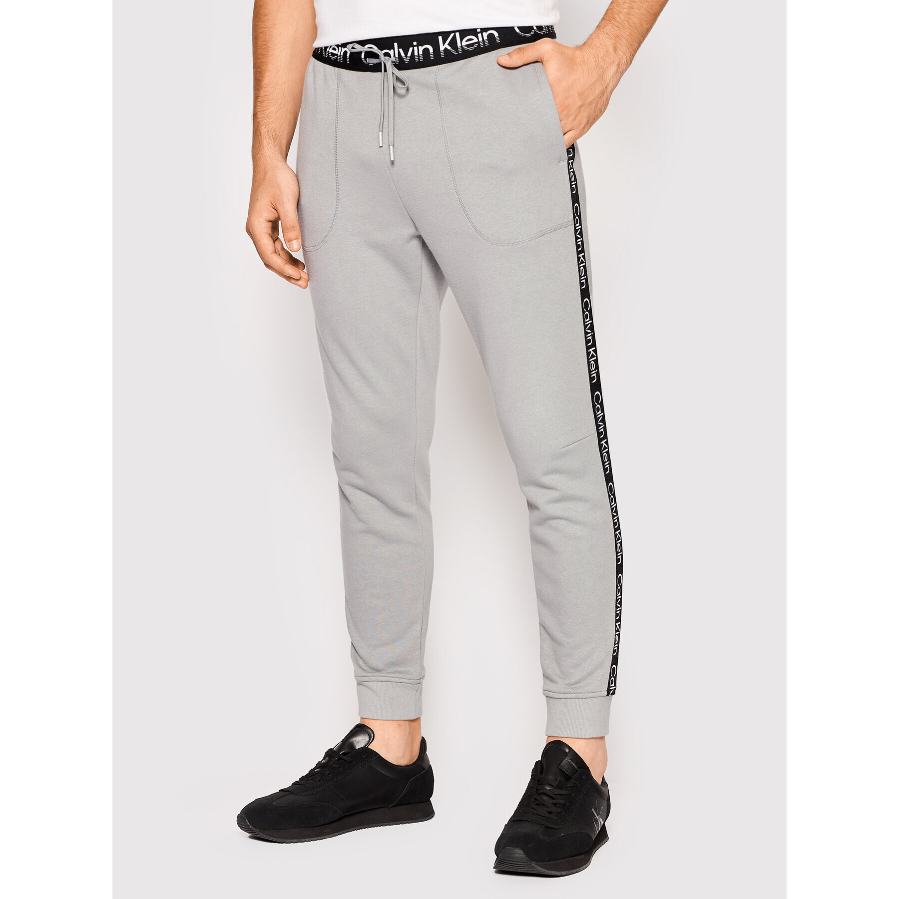 Calvin Klein Performance Spodnji del trenirke 00GMS2P600 Siva Regular Fit - Pepit.si