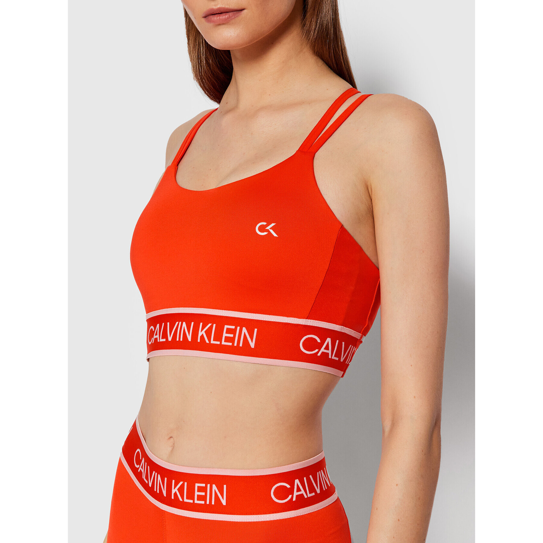 Calvin Klein Performance Špotni nedrček Low Support 00GWT1K125 Oranžna - Pepit.si