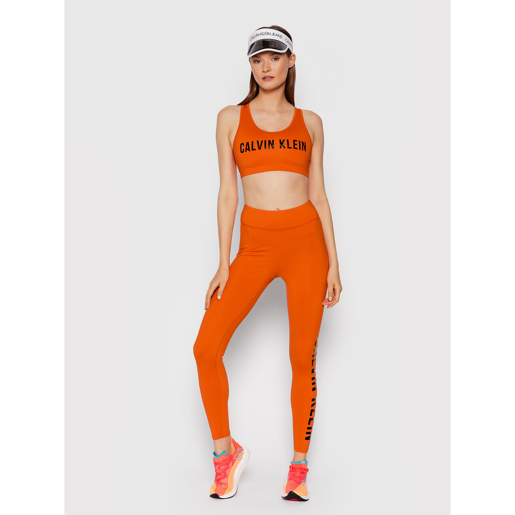 Calvin Klein Performance Špotni nedrček Medium Support 00GWF0K157 Oranžna - Pepit.si