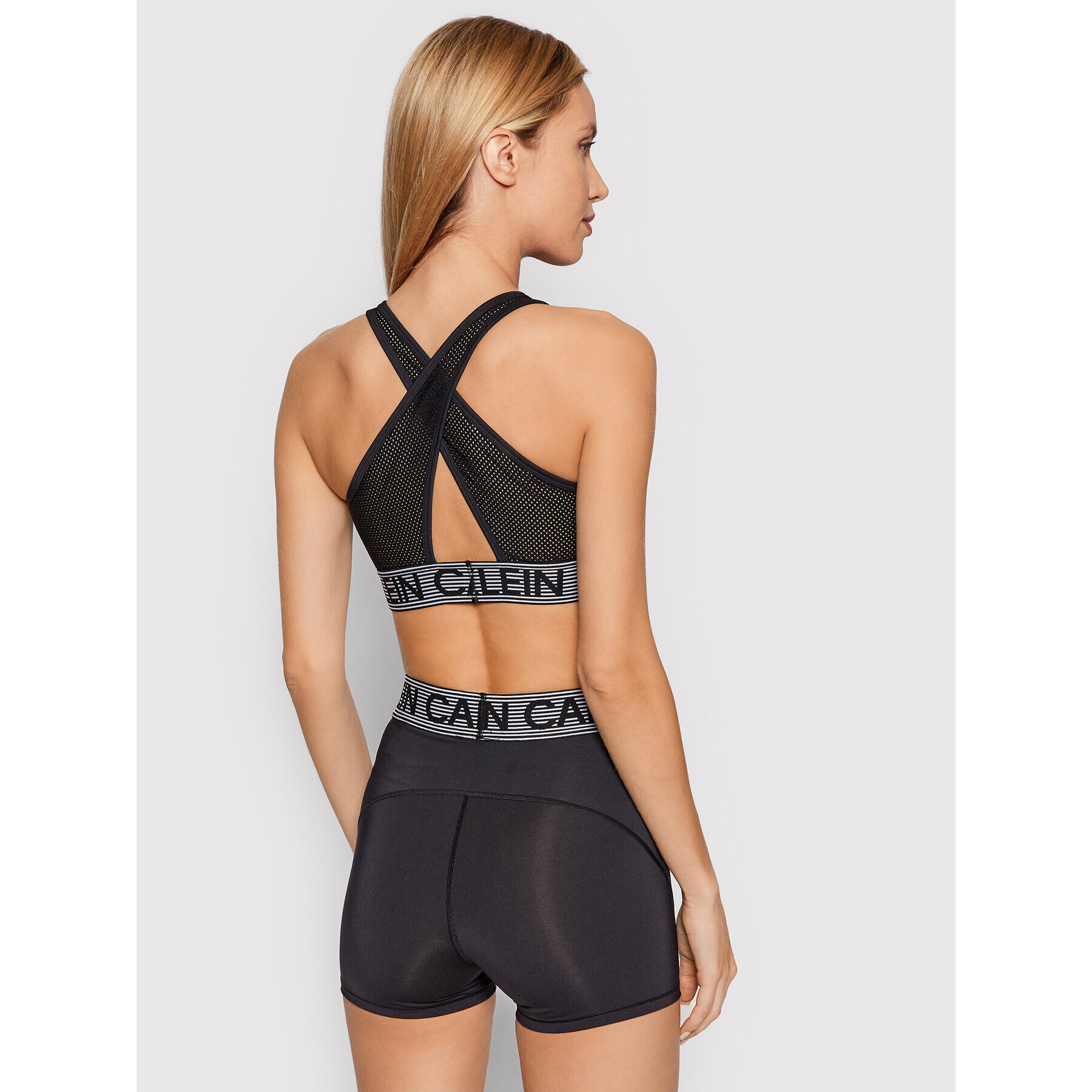 Calvin Klein Performance Špotni nedrček Medium Support Sports 00GWF1K108 Črna - Pepit.si