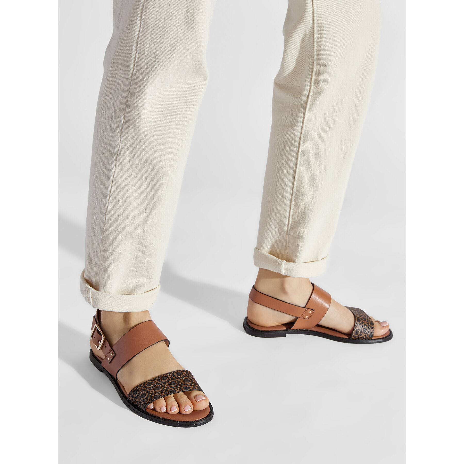 Calvin Klein Sandali Alomnd Flat Sandal Mono Mix HW0HW00821 Rjava - Pepit.si