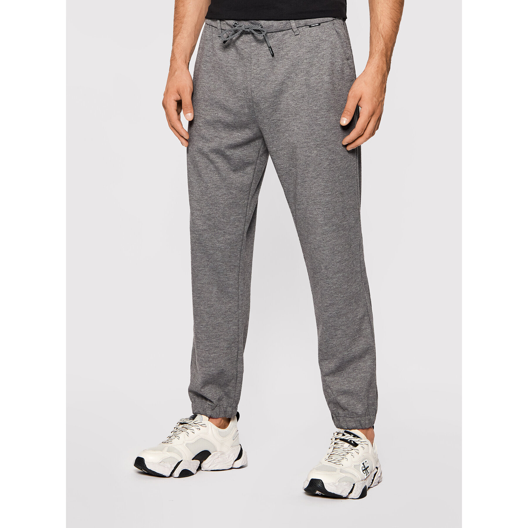 Calvin Klein Spodnji del trenirke Comfort K10K107498 Siva Regular Fit - Pepit.si