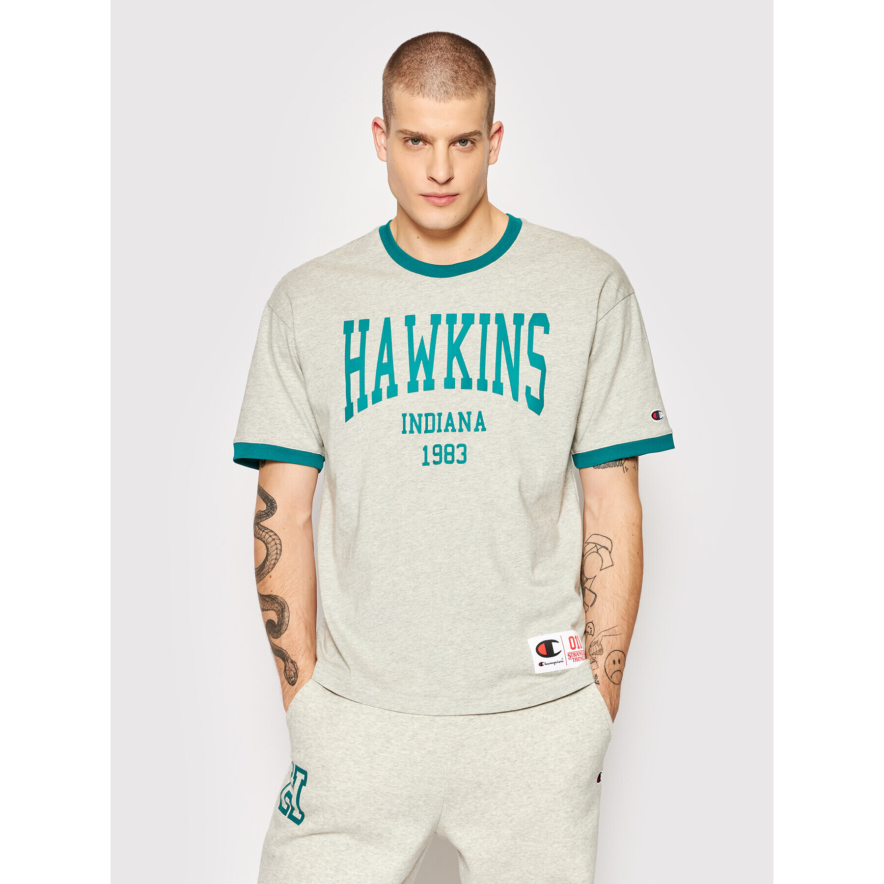 Champion Majica Unisex STRANGER THINGS Hawkins 217756 Siva Custom Fit - Pepit.si