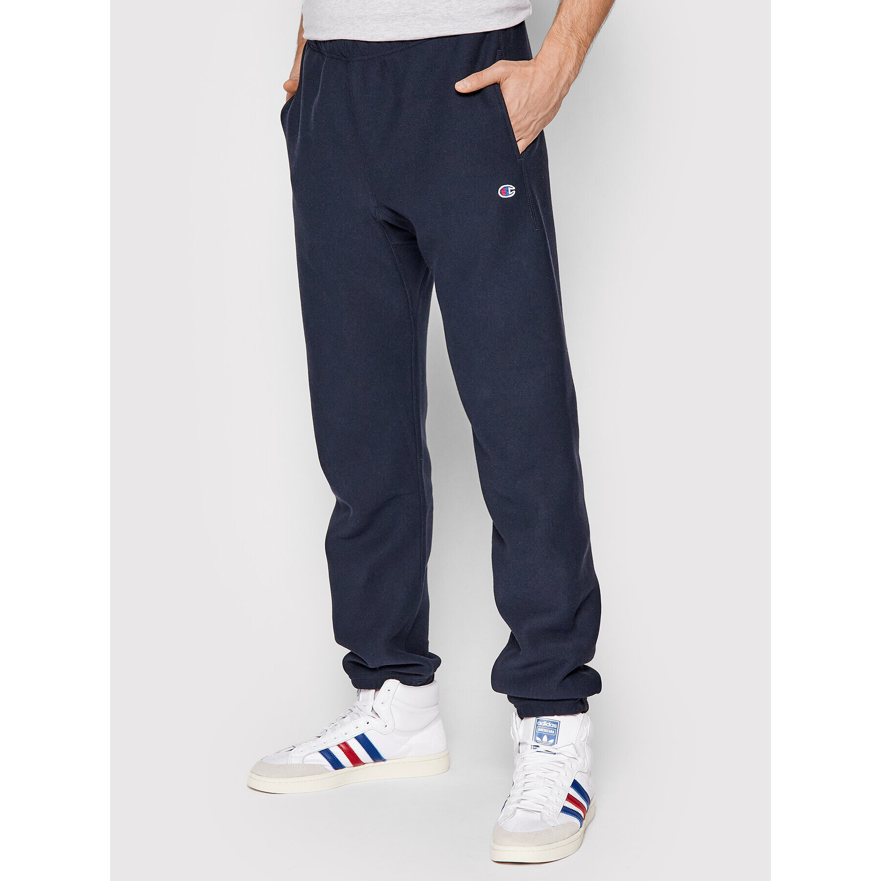 Champion Spodnji del trenirke Elasticated Cuffs 216540 Mornarsko modra Regular Fit - Pepit.si