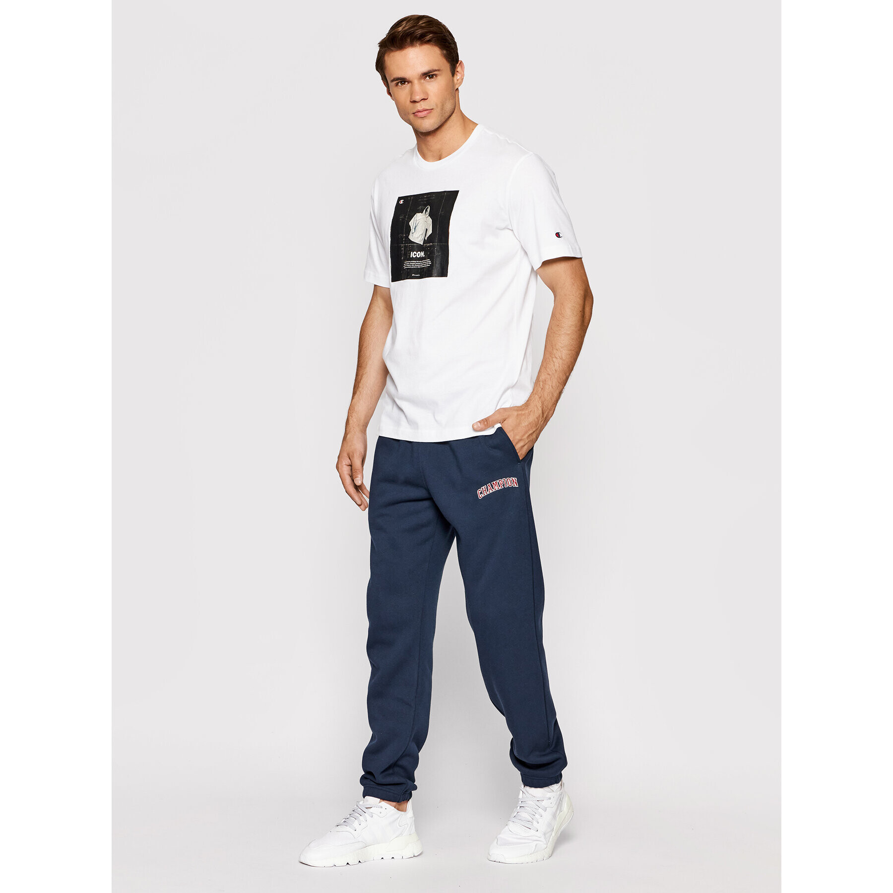 Champion Spodnji del trenirke Varsity Script Logo 216579 Mornarsko modra Regular Fit - Pepit.si